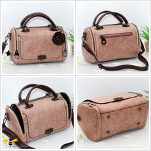 Load image into Gallery viewer, Boston styled faux leather barrel shaped dusky pink handbag featuring a vintage bronze bee embellishment