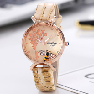 Ladies cream leather watch with an encased moving bee charm