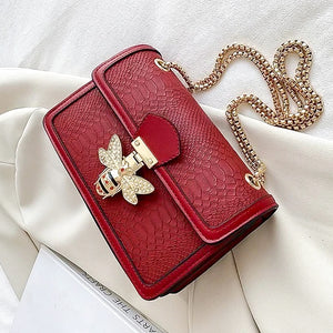 Embossed textured pu leather red handbag with bee decoration