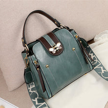 Load image into Gallery viewer, Flap over bumblebee two-toned vegan friendly leather handbag in sage green colour.