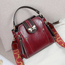 Load image into Gallery viewer, Flap over bumblebee two-toned vegan friendly leather handbag in maroon colour.