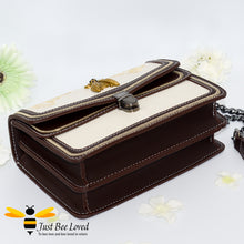 Load image into Gallery viewer, Rock chic styled vegan leather handbag featuring bold golden "Fabulous" embroidery with vintage gold bee embellishment in cream colour.
