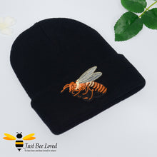 Load image into Gallery viewer, Black ribbed knit beanie skull caps featuring a large front embroidered bee motif.