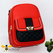 Load image into Gallery viewer, PU leather backpack featuring quilted flap-over front compartment with gold and cream bumblebee buckle clasp in red and black colour