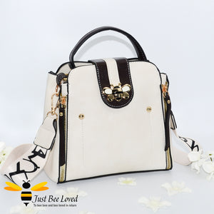 Flap over bumblebee two-toned vegan friendly leather handbag in ivory cream colour.