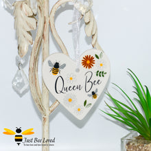 Load image into Gallery viewer, a ceramic hanging heart plaques with bees and daisies and "queen bee" text.