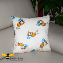 Load image into Gallery viewer, Children&#39;s decorative bee scatter cushion in cream featuring cartoon bumblebees
