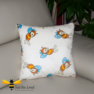 Children's decorative bee scatter cushion in cream featuring cartoon bumblebees