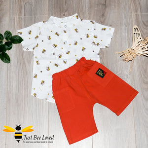 Shirt & short set for boys up to the age of 3 years.  White shirt patterned with cute little bees matched with red shorts.