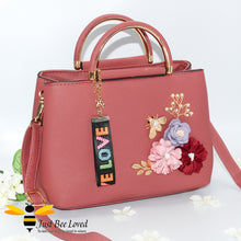 Load image into Gallery viewer, hand-crafted 3D embellished PU leather shoulder handbag featuring a cluster bouquet of colourful flowers, golden leaves with a pearlised bee in pink colour