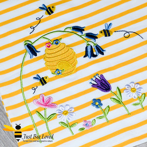 Girl's summer yellow striped T-shirt embroidered with honey bees, beehive and flowers.