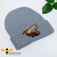 Load image into Gallery viewer, Grey ribbed knit beanie skull caps featuring a large front embroidered bee motif.