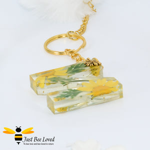 hand-crafted resin letter bee keyrings made with real pressed dried florals. Letter N
