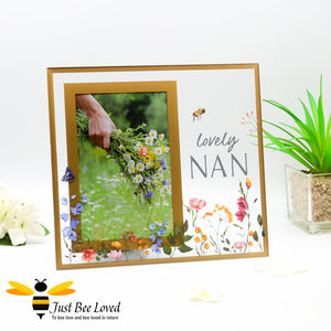 Glass photo frame with "lovely nan" decal, painted flowers and bumblebees