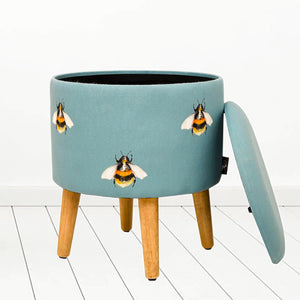 Meg Hawkins bumblebee illustration round storage footstool in teal blue colour with wooden legs