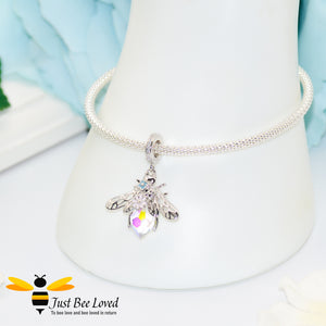 sterling silver bracelet engraved with two sentimental messages "Family Forever" and "Forever Love" and featuring a colourful queen bee charm pendant detailed with purple and pinks flowers.
