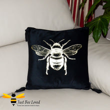 Load image into Gallery viewer, Black scatter cushion with large frontal gold bumblebee from Temerity Jones