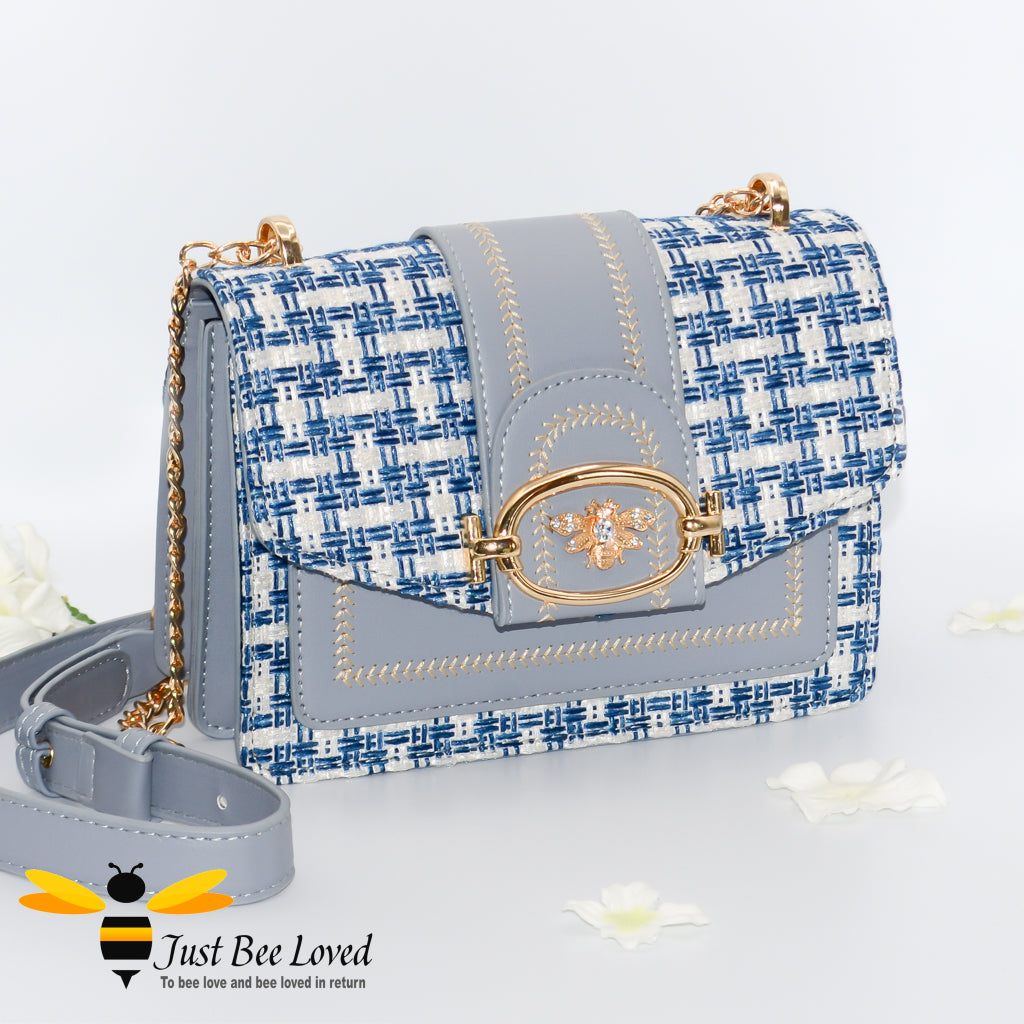 Woven faux leather handbag with gold bee decoration in blue colour