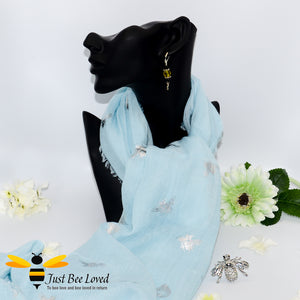 ladies scarf featuring metallic silver bumble bee print in pastel blue colour, gift boxed with crystal silver bee brooch. 