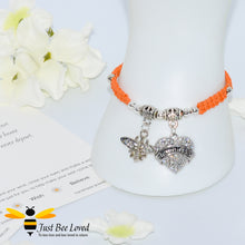 Load image into Gallery viewer, handmade Shamballa wish bracelet featuring a bee charm and love heart engraved with &quot;Daughter&quot; in orange colour