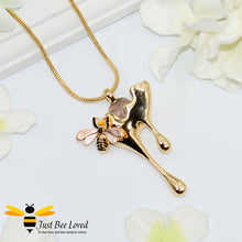 Load image into Gallery viewer, gold plated pendant necklaces each featuring golden honey drips, enamelled filled honeycomb to look like pollen with a honeybee.  