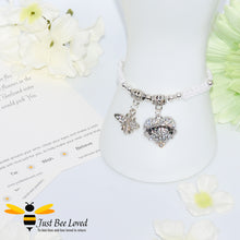 Load image into Gallery viewer, White Shamballa wish bracelet featuring a crystal bee and heart charm engraved with "Sister" and a sister verse card.