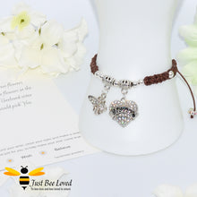 Load image into Gallery viewer, Brown Shamballa wish bracelet featuring a crystal bee and heart charm engraved with "Sister" and a sister verse card.