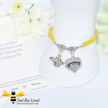 Load image into Gallery viewer, Yellow Shamballa wish bracelet featuring a crystal bee and heart charm engraved with "Sister" and a sister verse card.