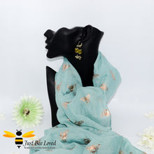 Load image into Gallery viewer, Women's pastel green lightweight scarf with gold bees print