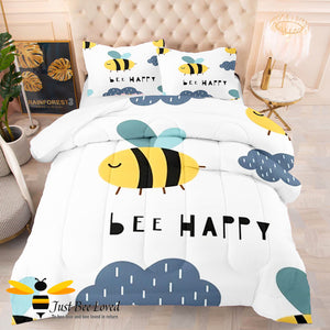 White and blue duvet cover set with bees and "bee happy" text.