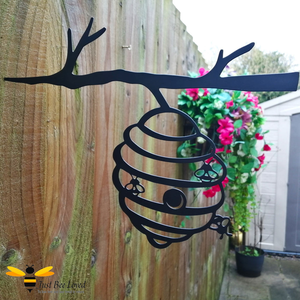 Black metal silhouette bee hive garden art