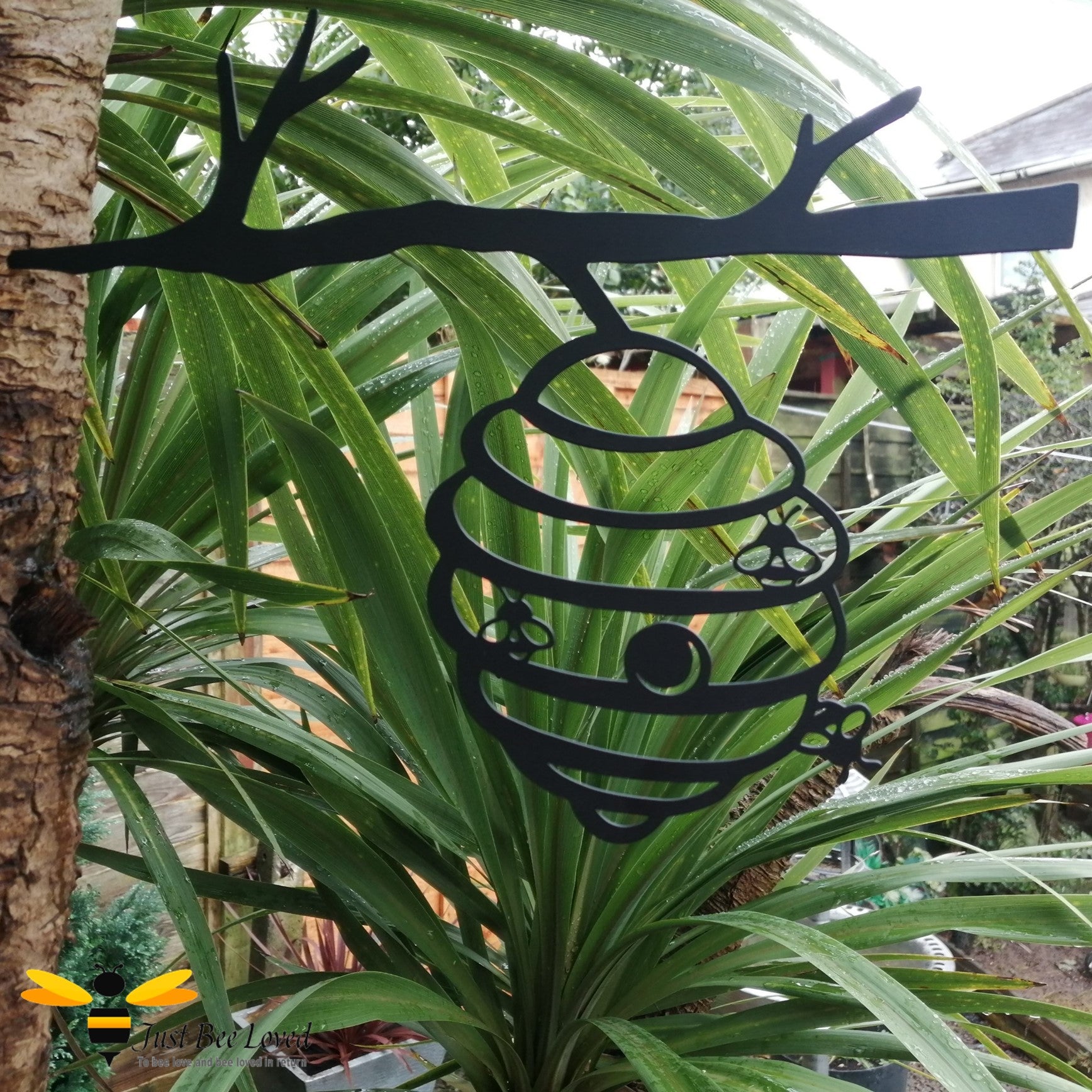 Black metal silhouette bee hive garden art