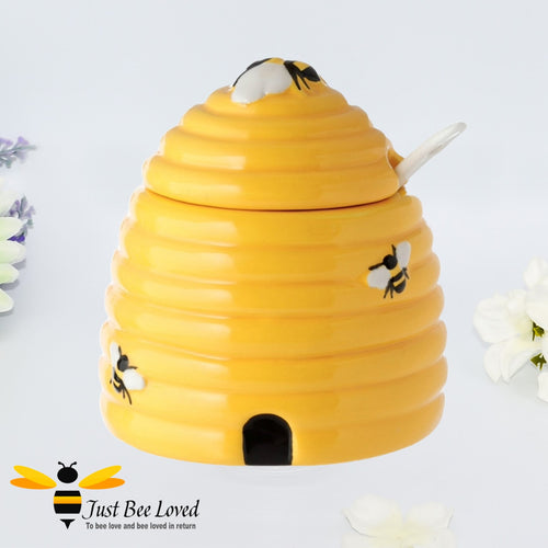 Yellow beehive shaped lidded pot with spoon