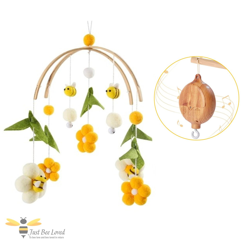 Baby cot crib mobile with yellow and white bees and flowers with a rotating music box.