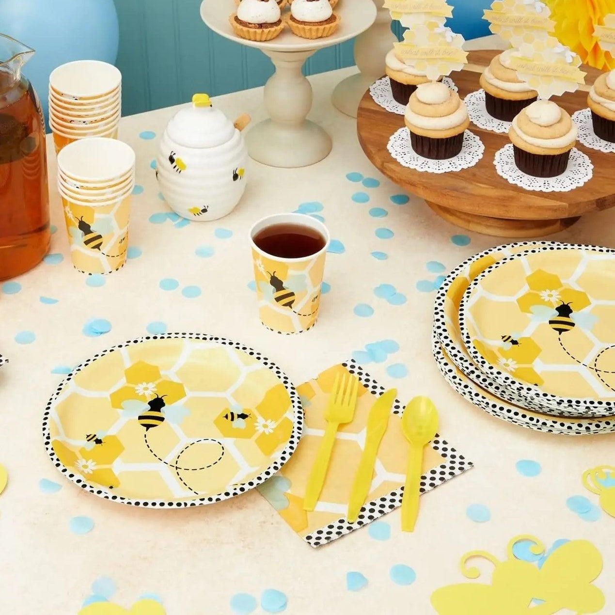 Bee themed disposable tableware set with plates, cups and napkins.