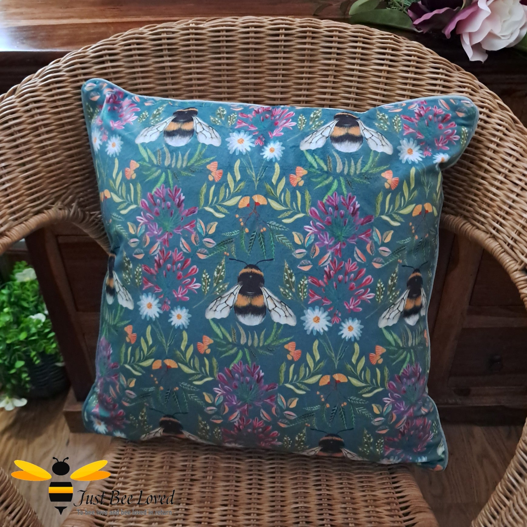 Wylder nature blue velvet bumble bee and florals cushion.