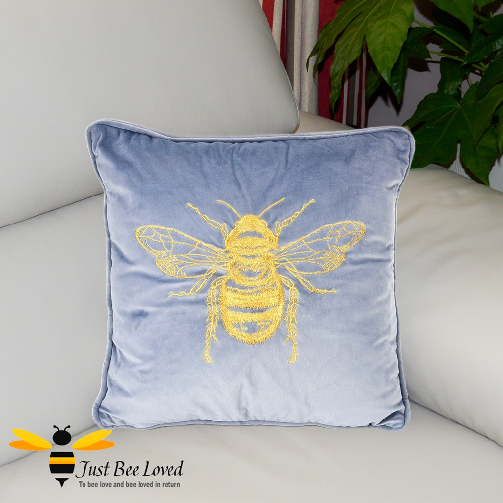 Blue velvet embroidered gold bee sofa cushion