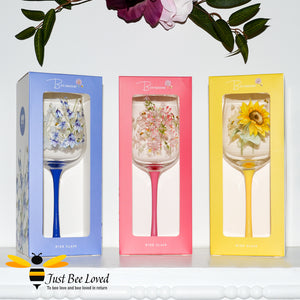 Tall stemmed wine glasses with florals and bumble bees decoration