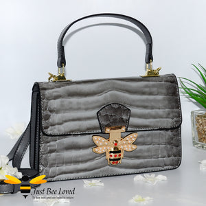 Dark grey Faux patent pu leather handbag with large gold bee clasp