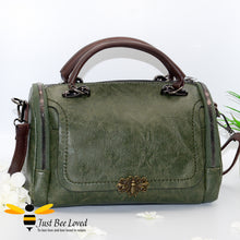 Load image into Gallery viewer, Boston styled faux leather barrel shaped dark green handbag featuring a vintage bronze bee embellishment.