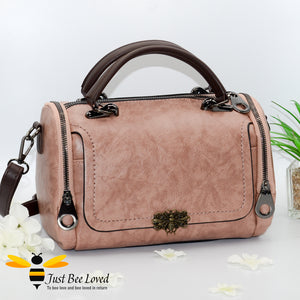 Boston styled faux leather barrel shaped dusky pink handbag featuring a vintage bronze bee embellishment.