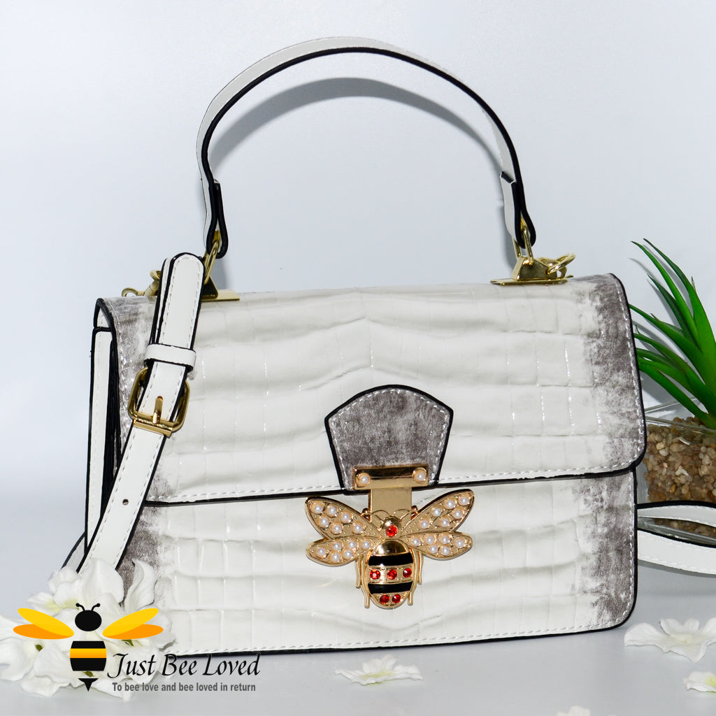 White Faux patent pu leather handbag with large gold bee clasp