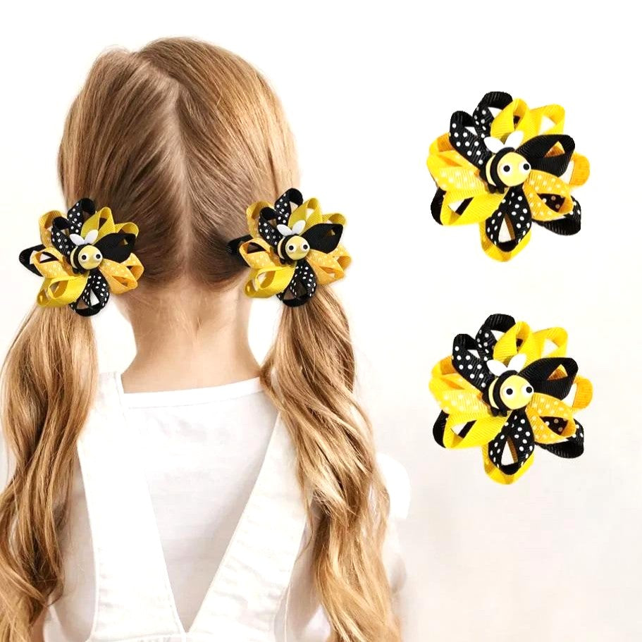 Girl wearing bee themed petal bow hair clips