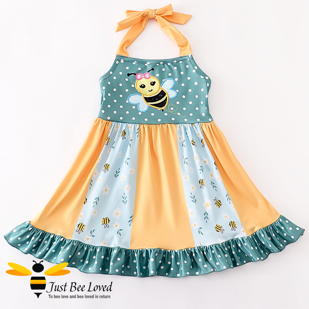 Girl's halter neck smock dress in orange and green with bumble bees print