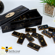 Load image into Gallery viewer, Set of handmade black and gold marble effect resin dominoes inlaid with gold bees in matching presentation box