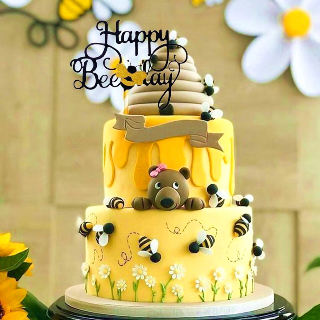 Happy brithday party cake topper with gold bee.