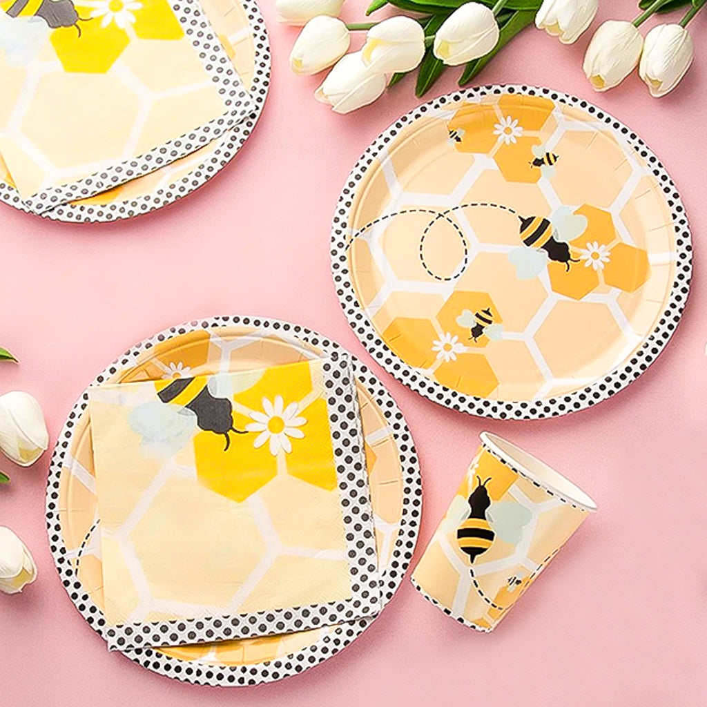 Bee themed disposable tableware set with plates, cups and napkins.