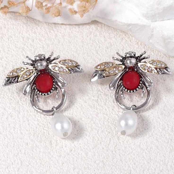 Vintage style bee shaped earrings with a teardop imitation pearl in silver colour.