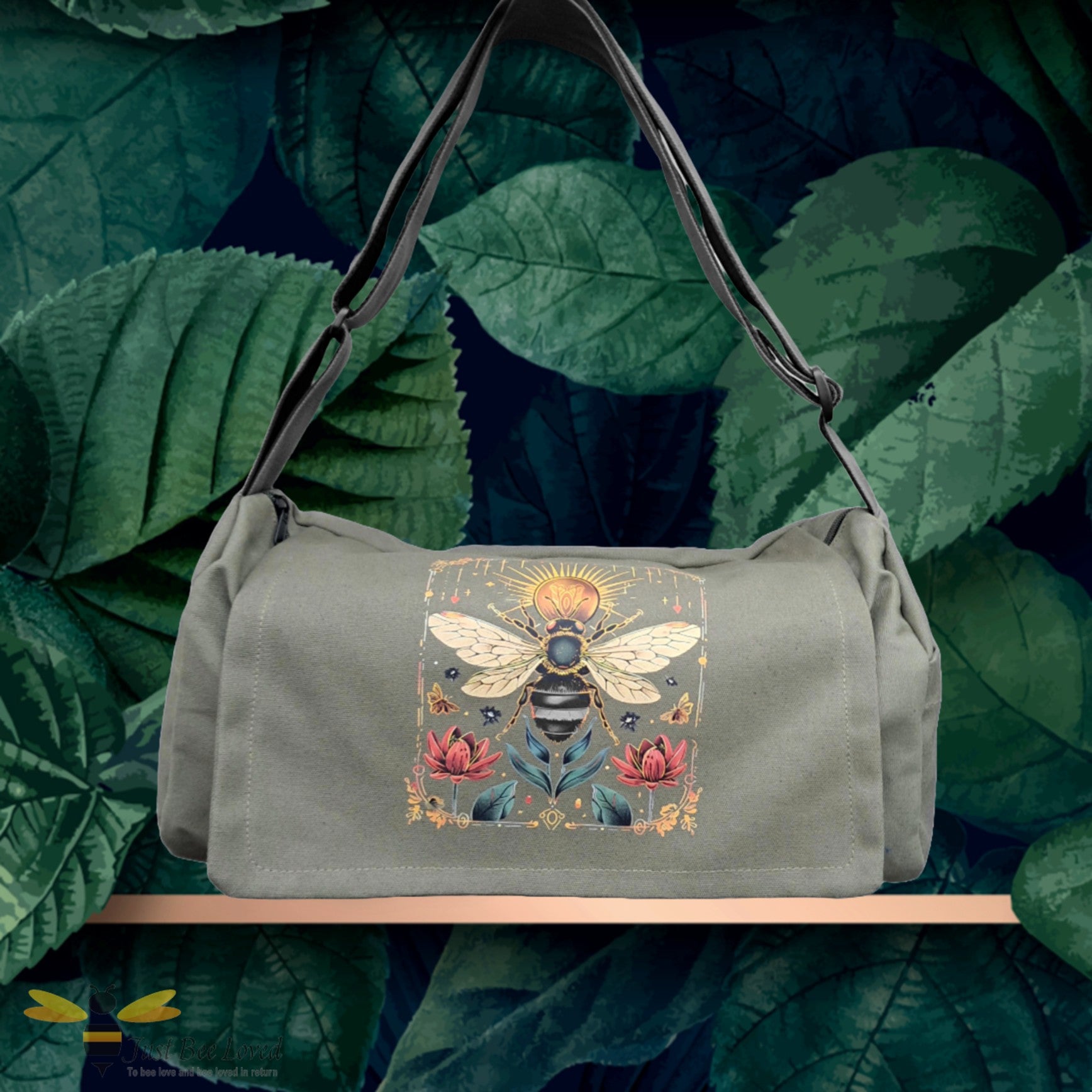 Khaki green canvas shoulder bag featuring a bee, sun and floral illustration print.
