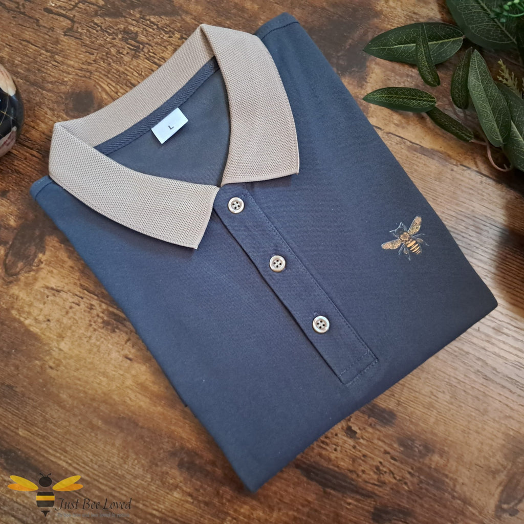 Grey polo shirt with bee motif detailing, beige colour collar.